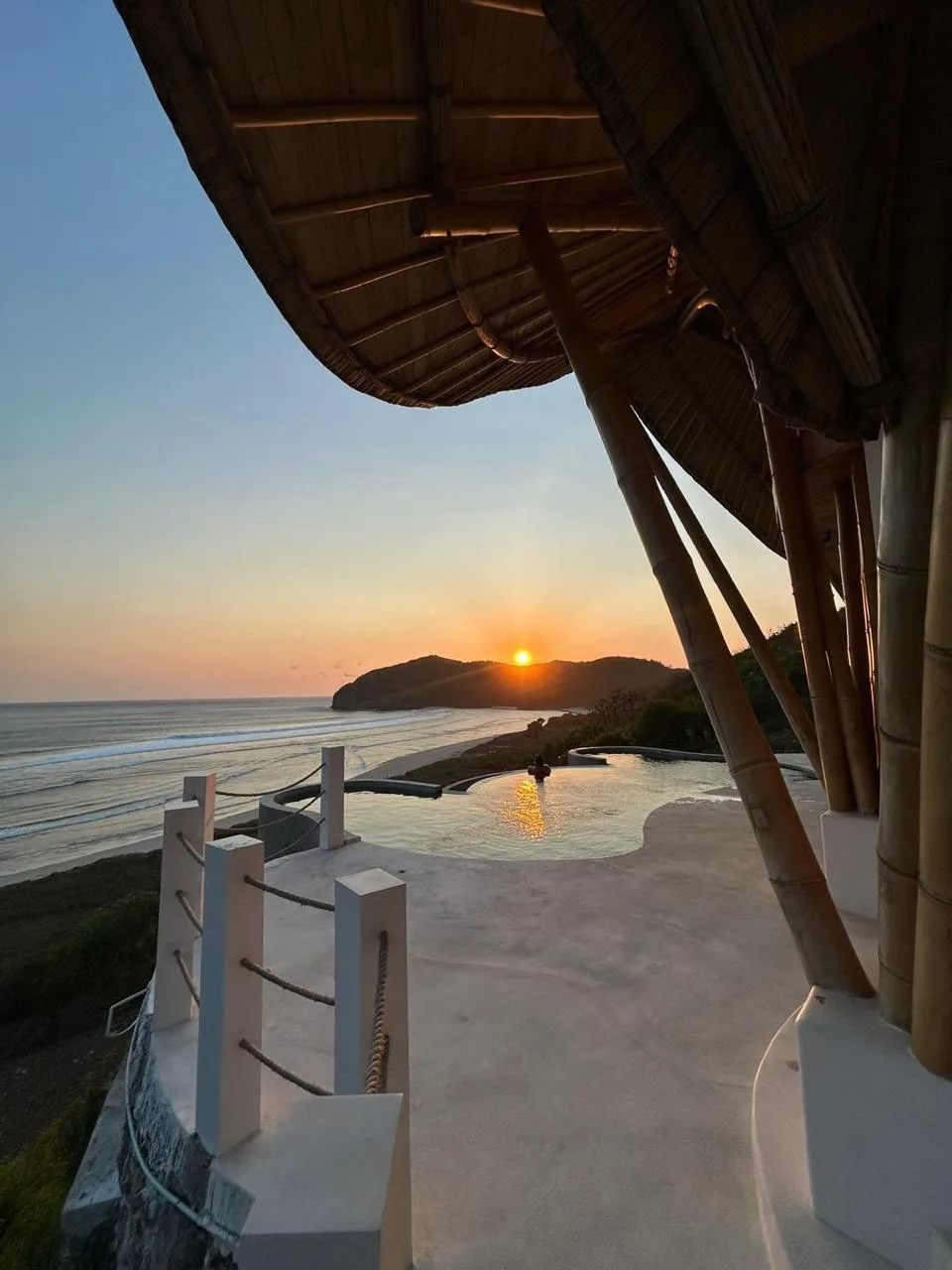 Manta Villa infinity pool at sunset